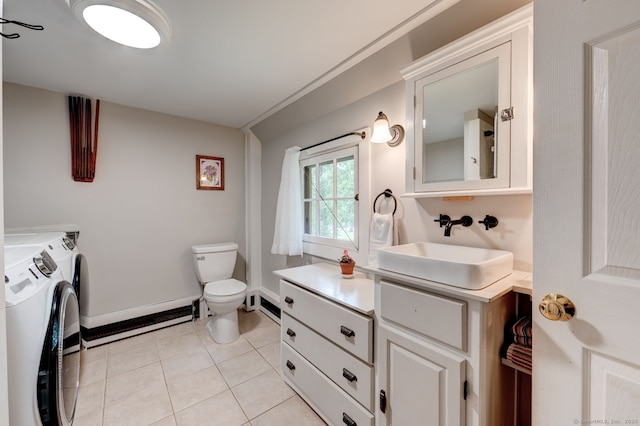 96 Middle Haddam Rd, East Hampton, CT 06456 - bathroom featuring washer and clothes dryer, a baseboard heating unit, toilet, vanity, and tile patterned flooring