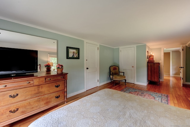 96 Middle Haddam Rd, East Hampton, CT 06456 - bedroom with light wood-type flooring, baseboards, and crown molding
