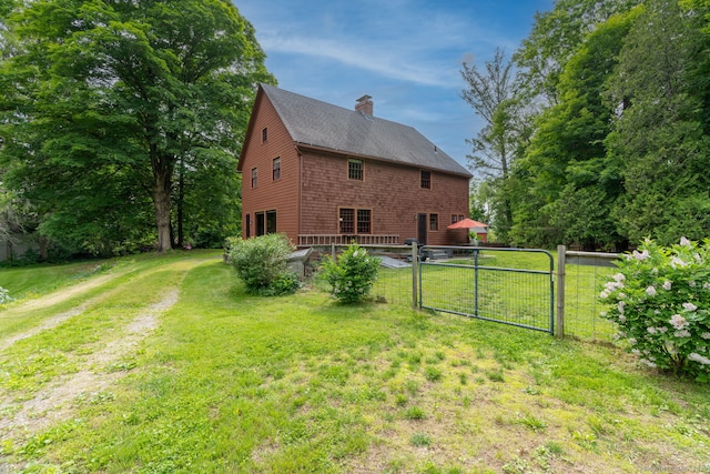 96 Middle Haddam Rd, East Hampton, CT 06456 - view of property exterior with a gate, a chimney, and a shingled roof