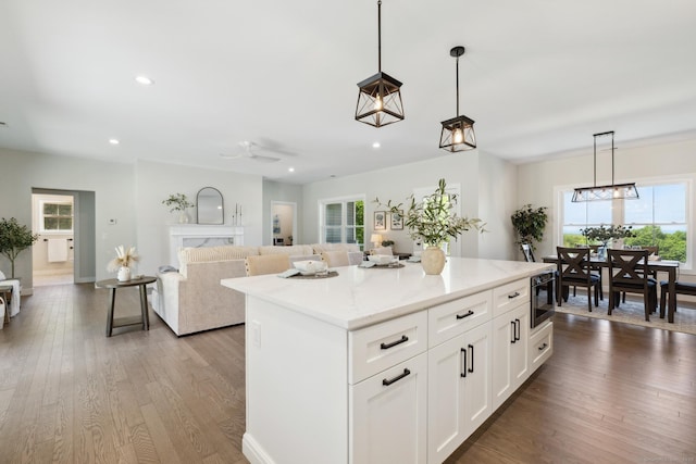 6 Turnpike Rd, Somers, CT 06071 - kitchen with plenty of natural light, white cabinetry, wood finished floors, a center island, and recessed lighting
