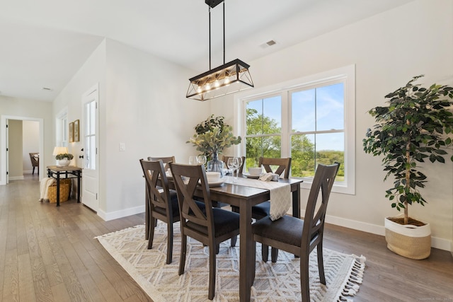 6 Turnpike Rd, Somers, CT 06071 - dining area with a chandelier, hardwood / wood-style flooring, and baseboards