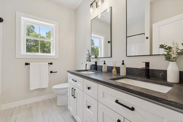 6 Turnpike Rd, Somers, CT 06071 - bathroom with double vanity, baseboards, and toilet