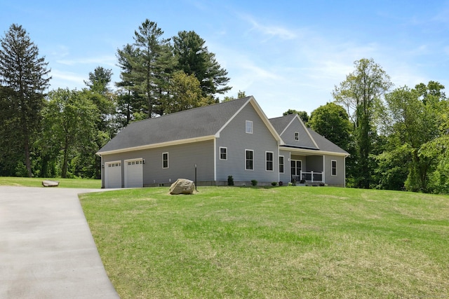 6 Turnpike Rd, Somers, CT 06071 - view of front of home with concrete driveway, an attached garage, and a front yard