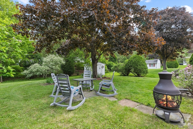 24 Boulder Trl, Killingworth, CT 06419 - view of green lawn featuring an outdoor fire pit and view of scattered trees