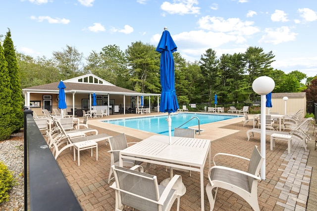 24 Boulder Trl, Killingworth, CT 06419 - community pool featuring a patio, view of scattered trees, and outdoor dining space