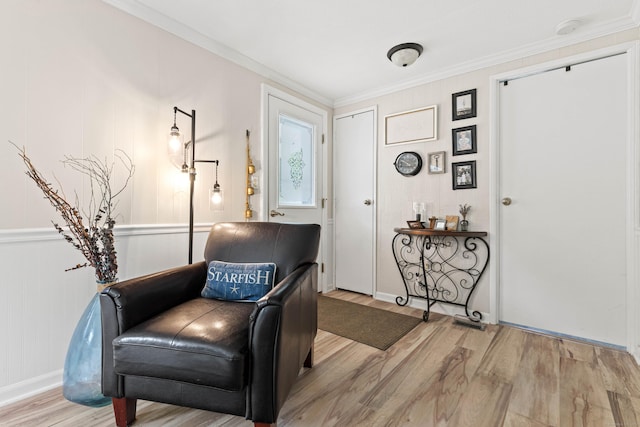 24 Boulder Trl, Killingworth, CT 06419 - living area with wood finished floors, crown molding, and a decorative wall