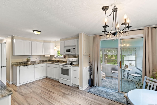 24 Boulder Trl, Killingworth, CT 06419 - kitchen with white appliances, a sink, a chandelier, light wood-style flooring, and pendant lighting