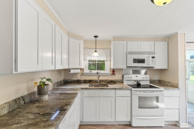 24 Boulder Trl, Killingworth, CT 06419 - kitchen featuring white appliances, a sink, white cabinets, decorative light fixtures, and dark stone counters