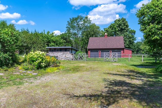 156 Ballamahack Rd, Windham, CT 06280 - view of yard featuring a garage, a gate, and an outbuilding