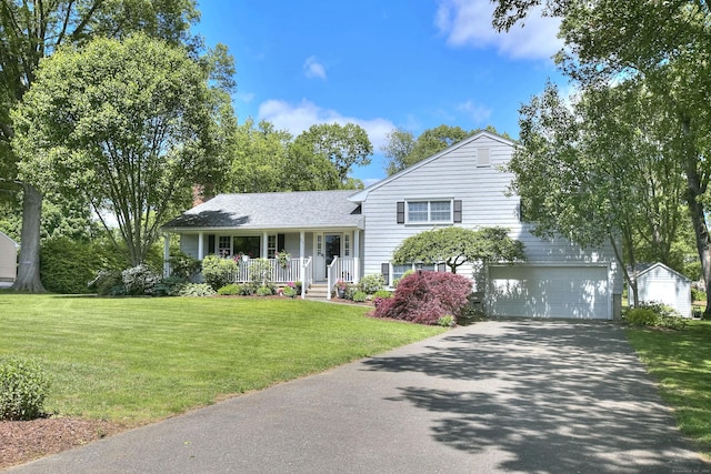 85 Oakridge Rd, Trumbull, CT 06611 - tri-level home featuring covered porch, asphalt driveway, a garage, a front yard, and a chimney