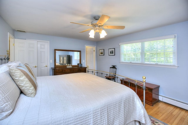 85 Oakridge Rd, Trumbull, CT 06611 - bedroom with wood finished floors, baseboard heating, a closet, a ceiling fan, and baseboards