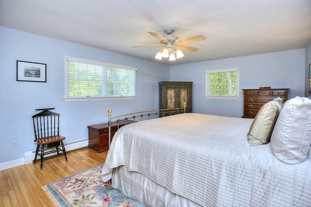 85 Oakridge Rd, Trumbull, CT 06611 - bedroom with a baseboard radiator, light wood finished floors, a ceiling fan, and baseboards