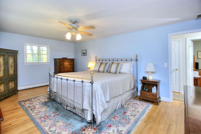 85 Oakridge Rd, Trumbull, CT 06611 - bedroom with a baseboard heating unit, wood finished floors, ceiling fan, and baseboards