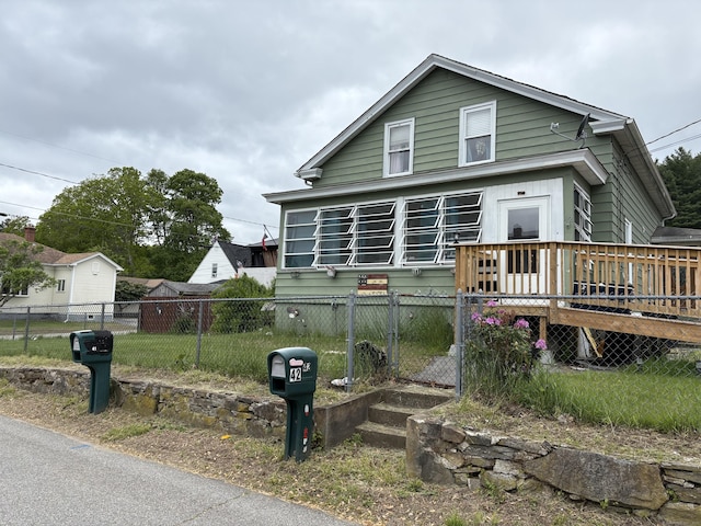 42 First St, Thompson, CT 06255 - view of front of home featuring a fenced front yard and a deck