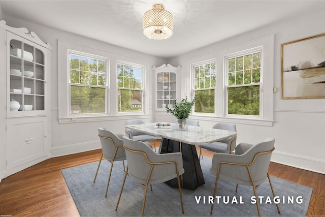 10 Paddock Pl, Milford, CT 06461 - dining room featuring plenty of natural light, wood finished floors, and baseboards