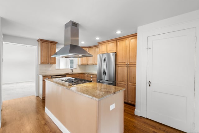 10 Paddock Pl, Milford, CT 06461 - kitchen with stainless steel appliances, island exhaust hood, a sink, wood finished floors, and recessed lighting
