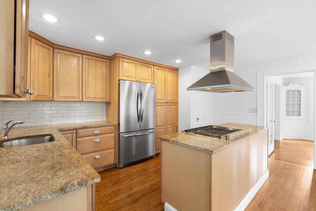 10 Paddock Pl, Milford, CT 06461 - kitchen featuring appliances with stainless steel finishes, island exhaust hood, a sink, light wood-type flooring, and light stone countertops