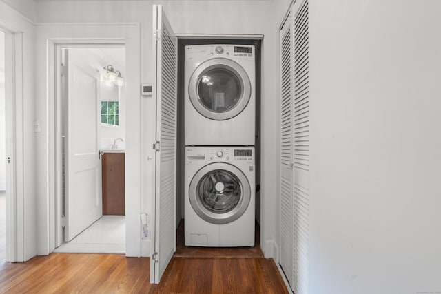 10 Paddock Pl, Milford, CT 06461 - laundry area featuring stacked washer / drying machine and wood finished floors