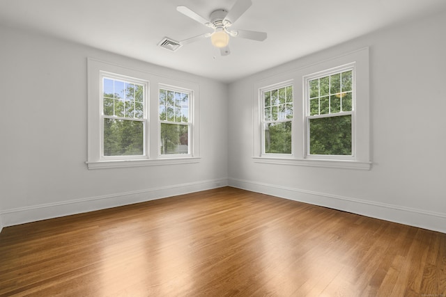 10 Paddock Pl, Milford, CT 06461 - unfurnished room with plenty of natural light, wood finished floors, and baseboards