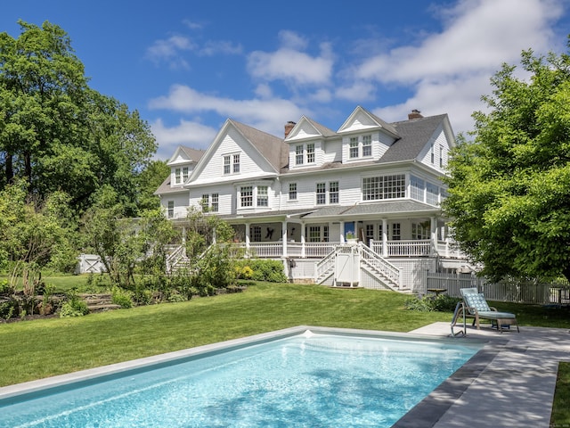 304 Main St, Ridgefield, CT 06877 - back of property with an outdoor pool, a chimney, stairs, and a patio