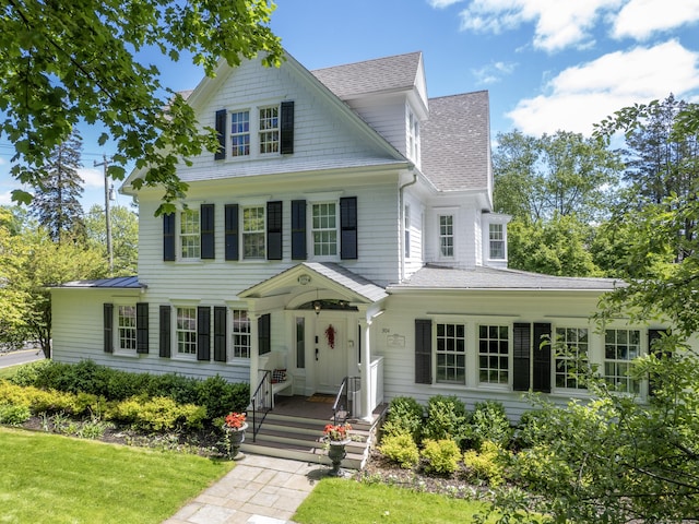 304 Main St, Ridgefield, CT 06877 - view of front facade with roof with shingles and a front yard