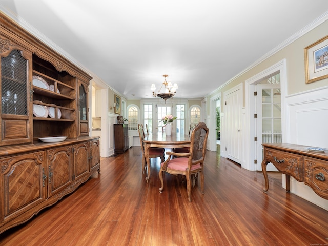 304 Main St, Ridgefield, CT 06877 - dining room with a chandelier, dark wood-type flooring, crown molding, and a decorative wall