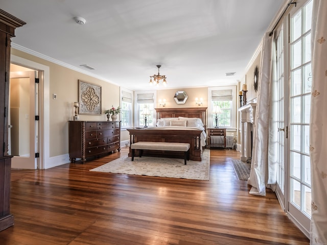 304 Main St, Ridgefield, CT 06877 - bedroom featuring ornamental molding, radiator, hardwood / wood-style flooring, multiple windows, and a chandelier