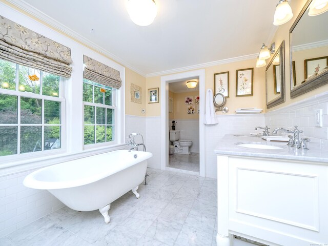 304 Main St, Ridgefield, CT 06877 - full bathroom with tile walls, a freestanding bath, ornamental molding, double vanity, and wainscoting