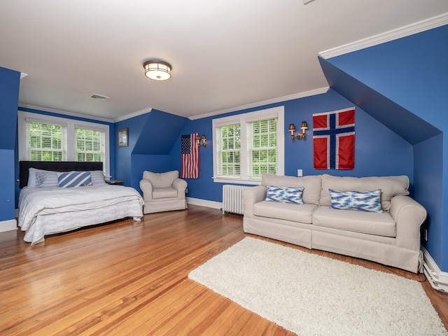 304 Main St, Ridgefield, CT 06877 - bedroom featuring radiator heating unit, wood finished floors, crown molding, multiple windows, and baseboards