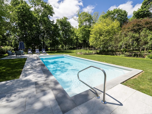 304 Main St, Ridgefield, CT 06877 - outdoor pool with a patio, a lawn, and view of wooded area