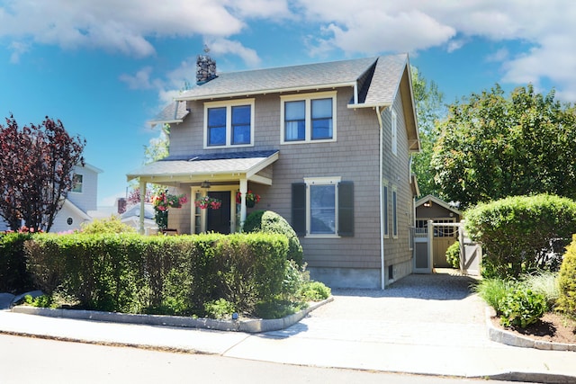 11 Elliott St, Norwalk, CT 06855 - american foursquare style home with a shingled roof, a chimney, and driveway