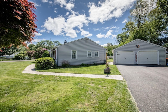 7 Cheryl Ave, Wallingford, CT 06492 - view of home's exterior with an outbuilding, a detached garage, and a lawn