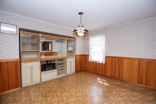 7 Cheryl Ave, Wallingford, CT 06492 - bar area with a wainscoted wall, ornamental molding, wooden walls, wallpapered walls, and pendant lighting