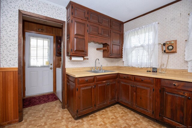 7 Cheryl Ave, Wallingford, CT 06492 - kitchen featuring a sink, ornamental molding, wallpapered walls, and light countertops