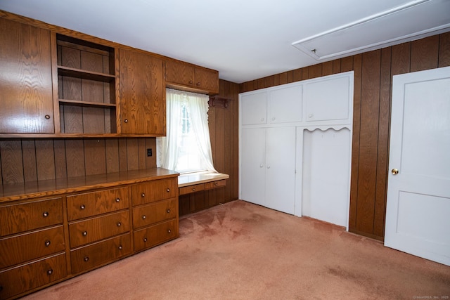 7 Cheryl Ave, Wallingford, CT 06492 - unfurnished bedroom featuring light colored carpet, attic access, a closet, and wood walls