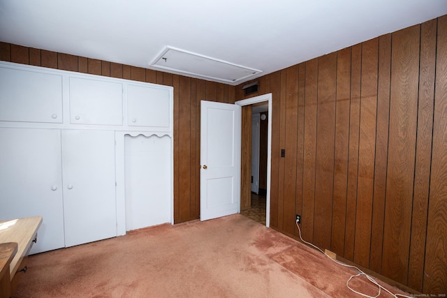 7 Cheryl Ave, Wallingford, CT 06492 - unfurnished bedroom featuring attic access, carpet, wooden walls, and a closet