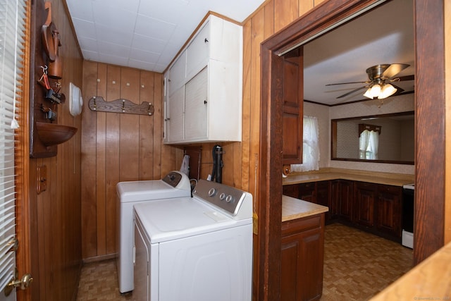 7 Cheryl Ave, Wallingford, CT 06492 - laundry area featuring washer and dryer, cabinet space, wood walls, tile patterned floors, and a ceiling fan