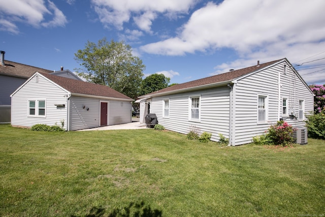 7 Cheryl Ave, Wallingford, CT 06492 - rear view of property featuring central AC, a patio area, and a lawn