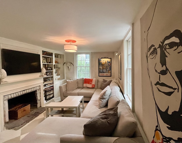 118 Sanfordtown Rd, Redding, CT 06896 - living area featuring a fireplace with raised hearth and built in shelves