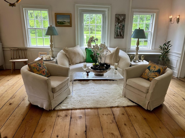 118 Sanfordtown Rd, Redding, CT 06896 - living area featuring hardwood / wood-style floors, healthy amount of natural light, and a wainscoted wall