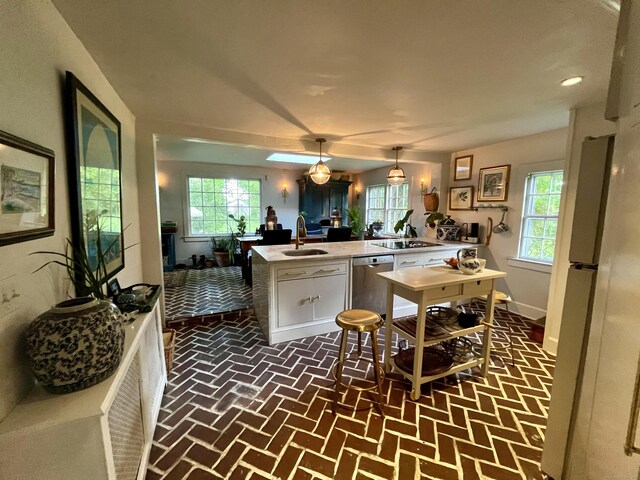 118 Sanfordtown Rd, Redding, CT 06896 - kitchen with stainless steel dishwasher, white cabinets, a sink, and healthy amount of natural light