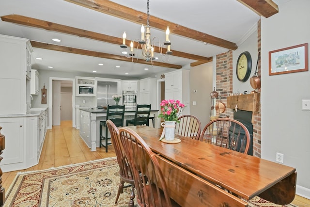 11 Ledgewood Rd, Redding, CT 06896 - dining room featuring beam ceiling, a chandelier, light wood finished floors, recessed lighting, and a brick fireplace