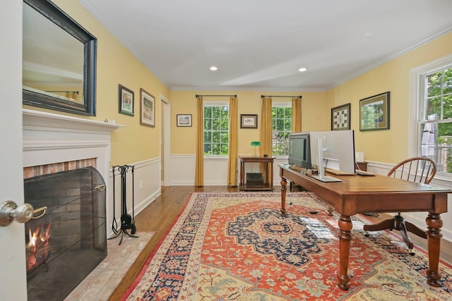 11 Ledgewood Rd, Redding, CT 06896 - office area with a brick fireplace, wood finished floors, crown molding, healthy amount of natural light, and wainscoting
