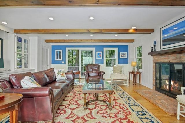 11 Ledgewood Rd, Redding, CT 06896 - living area featuring recessed lighting, light wood-style floors, healthy amount of natural light, a decorative wall, and a brick fireplace