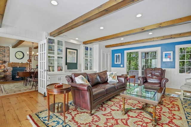 11 Ledgewood Rd, Redding, CT 06896 - living area featuring light wood-style flooring, beamed ceiling, recessed lighting, a wainscoted wall, and a fireplace