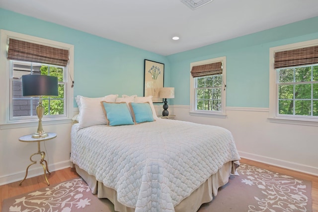 11 Ledgewood Rd, Redding, CT 06896 - bedroom with multiple windows, wood finished floors, and baseboards