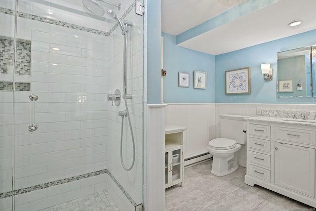 11 Ledgewood Rd, Redding, CT 06896 - full bathroom featuring baseboard heating, toilet, a shower stall, vanity, and a wainscoted wall