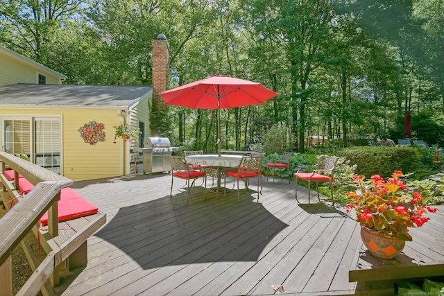 11 Ledgewood Rd, Redding, CT 06896 - wooden deck with outdoor dining space and view of scattered trees
