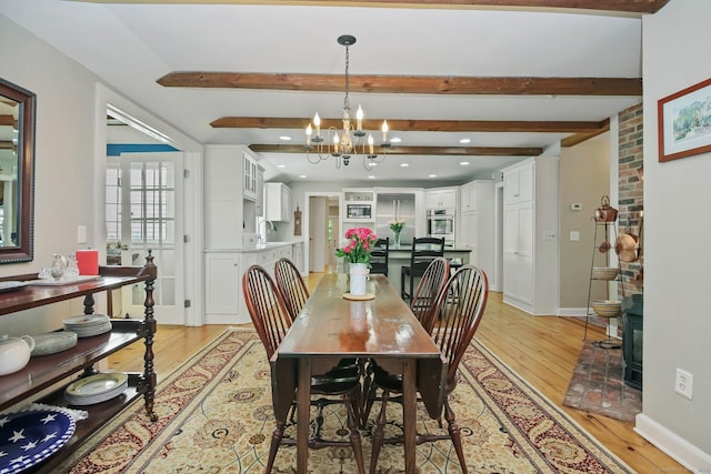 11 Ledgewood Rd, Redding, CT 06896 - dining room with light wood-style floors, a chandelier, beamed ceiling, recessed lighting, and baseboards
