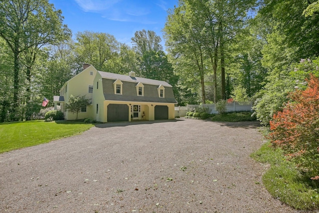 11 Ledgewood Rd, Redding, CT 06896 - colonial inspired home featuring a gambrel roof, a garage, driveway, and a chimney
